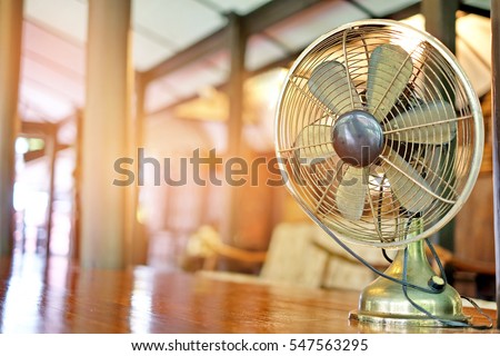 Antique and old electronic metal fan in vintage house thailand