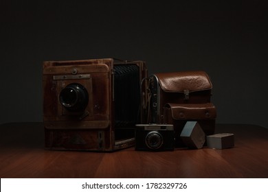 Antique photo tools, photo flash with leather backpack, film camera, direct-sight camera