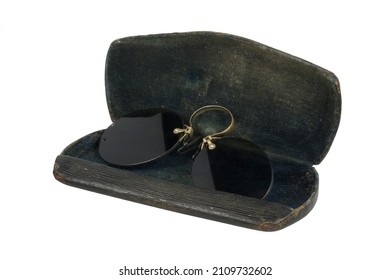 antique pince-nez with dark glasses in a case