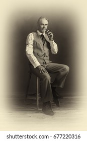 Antique Plate Photo Of Middle Aged Vintage 1920s Man Wearing Suit With Cigar Sitting On Wooden Stool.