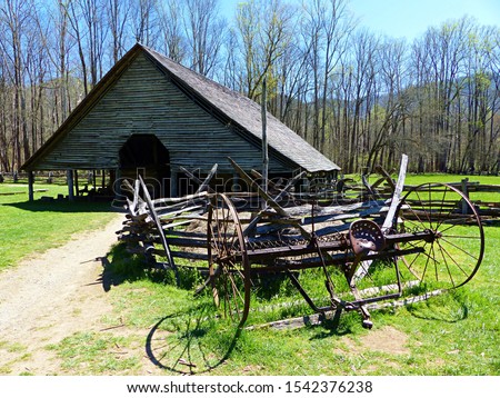 An antique plow sits in front of an old barn at the Oconaluftee Farm Museum at the Great Smoky Mountains National Park near Cherokee, North Carolina. 
