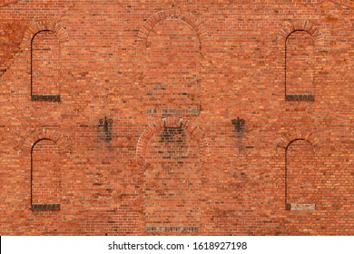 Antique Red Brick Wall With Window Openings.