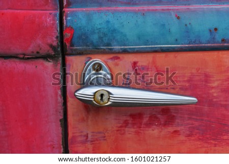 Antique Red Ford Door Handle Weathered and Rusted