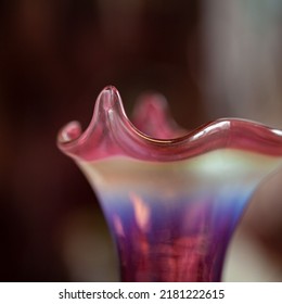 Antique Red Glass Flower Vase In The Interior. Figured Vase Close-up. Macro Glass Texture