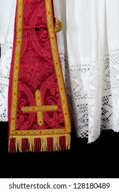 Antique Red Maniple Hanging Over The Lace Edge Of An Old Priest Surplice