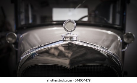 Antique Roadster With Polished Chrome Grill And Hood Ornament