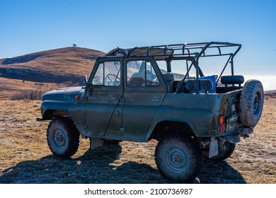 Antique Russian off-road car on top of a mountain in Crimea