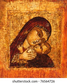 Antique Russian orthodox icon of Mother of God (Mary) and child (Jesus Christ) painted on wooden board.