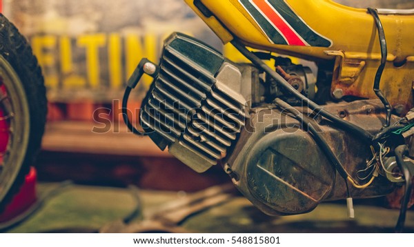The\
antique rusty engine of a motorcycle. (vintage\
style)