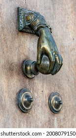 Antique Scratched Door Knocker With A Ball In Hand