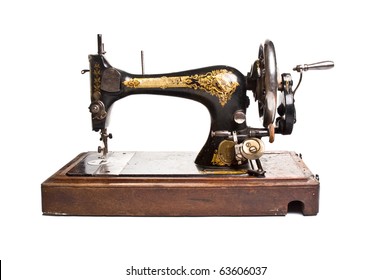 Antique sewing-machine on white background