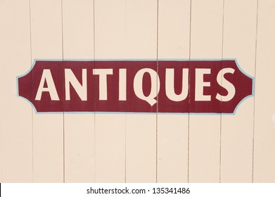 Antique Sign Painted On A Wooden Surface