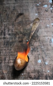 Antique Spoon With Fire At The Base