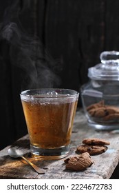 Antique Spoon On A Weathered Wooden Table