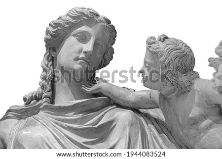 Antique statue of Eirene with the infant Ploutos isolated on white background. Goddess of Peace beautiful young woman carrying a cornucopia and a torch or rhyton.