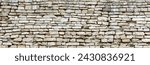 antique stone wall, old stonework made of cobblestones and concrete