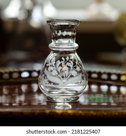 Antique Transparent Glass Vase In Luxury Interior. Crystal Vase With Engraving. Glass Close-up