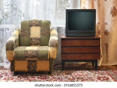 An Antique TV Stands On An Old Wooden Cabinet, Antique Design In A 1980s And 1990s Style Home. Interior In The Style Of The USSR.