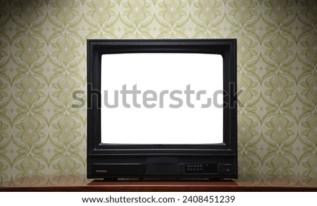 Antique TV with white screen on antique wooden cabinet, vintage design in 80s and 90s style house.