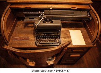 Antique typewriter on an old wooden desk