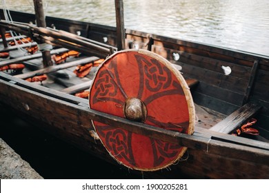 An antique Viking ship on the river. Old boat - Shutterstock ID 1900205281
