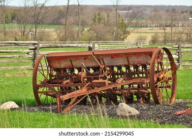 Antique Vintage Farm Seeder Rusty Farm Implement In Field