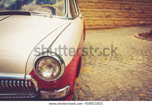 Antique vintage retro red automobile bumper car
front light
