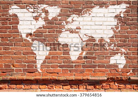 Antique wall from brick with World map graffiti
