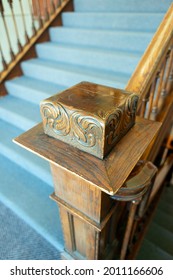 An Antique Wood Banister With Intricate Carving