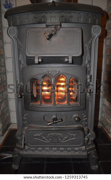 Antique Wood Stove Burning Royalty Free Stock Image