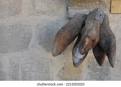 Antique  Wooden Cobbler  Shoe Molds Needed To Make Shoes Hang On An Old Stone Wall