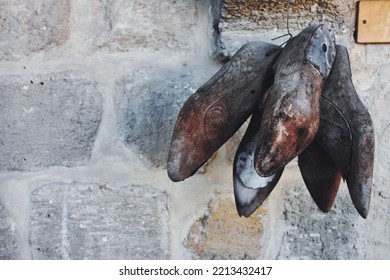 Antique  Wooden Cobbler  Shoe Molds Needed To Make Shoes Hang On An Old Stone Wall