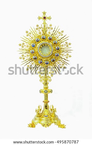 Antiques gold monstrance on white background