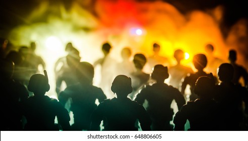 Anti-riot police give signal to be ready. Government power concept. Police in action. Smoke on a dark background with lights. Blue red flashing sirens. Dictatorship power - Shutterstock ID 648806605