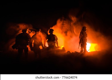 Anti-riot police give signal to be ready. Government power concept. Police in action. Smoke on a dark background with lights. Blue red flashing sirens. Dictatorship power - Shutterstock ID 776624074