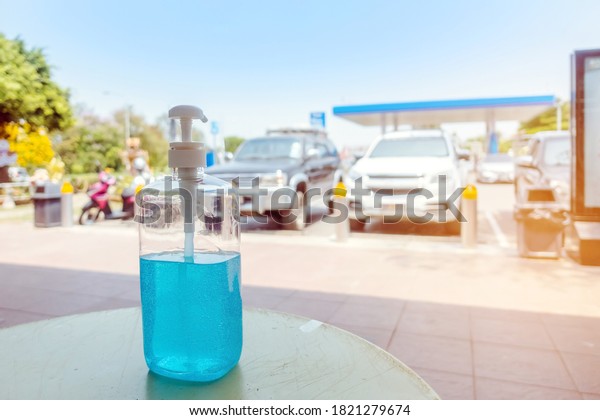 Antiseptic hand gel or\
alcohol gel prevent the spread of germs and bacteria and avoid\
infections corona virus,covid-19 prevention for serving customers\
in the gas station.