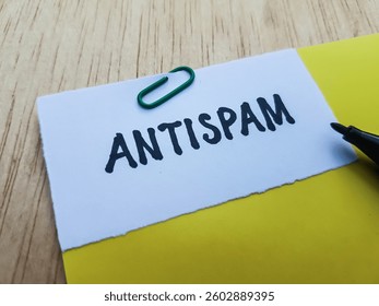 Antispam writting on table background.