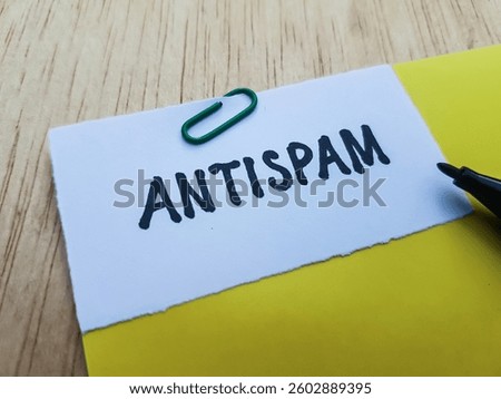 Antispam writting on table background.