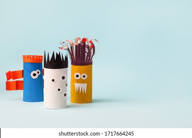 Antistress Art Therapy For Kids, Coronavirus Pandemic, Monsters For Halloween Party. Easy Crafts For Kids On Blue Background, Copy Space, Diy Creative Idea From Toilet Tube, Recycle Concept