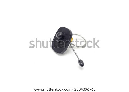 Anti-theft sensor-tag on a white background.