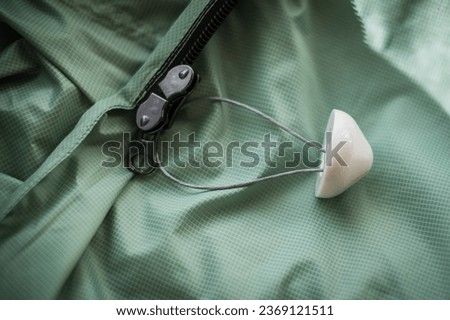 Anti-theft system device on expensive product. Clothing security tag. 