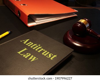 Antitrust law is shown on the conceptual photo using the text
