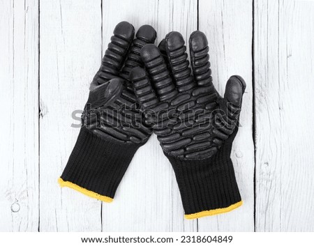 Anti-vibration glove, tactical gloves, protective gloves on a white background.