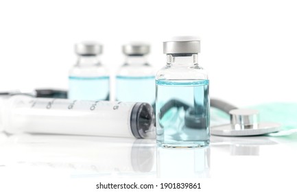 Antiviral vaccine bottle and medical stethoscope Syringe on a white background