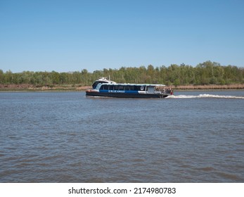 Antwerp, Belgium, April 17, 2022, The waterbus, called Blue Amigo, sails on the Scheldt to Steenplein in Antwerp