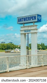 Antwerp, Belgium - August 8, 2021 - vertical view of Antwerp (Antwerpen) port sign on the Scheldt river