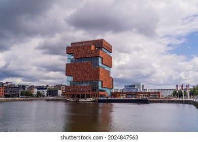 Antwerp, Belgium - August 8, 2021 - panorama view of the port and the modern MAS (Museum aan de Stroom) on a cloudy day