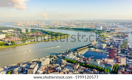 Antwerp, Belgium. Flying over the roofs of the historic city. Schelde (Esco) river. Industrial area of the city, Aerial View  