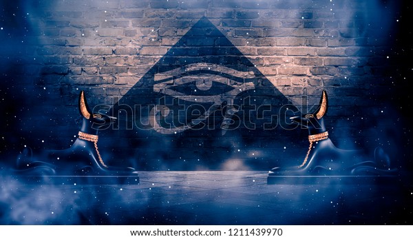 Anubis of Ancient Egypt (God of Death). Dark\
abstract Egyptian background, dark room with smoke, sparks from\
lights, rays of light.