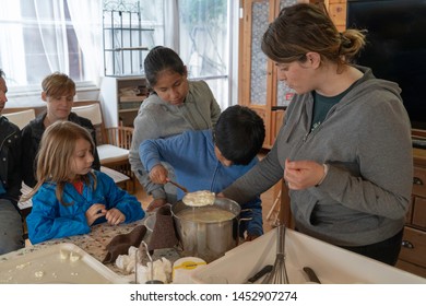 Anversa, Abruzzo / Italy -June 2 2019: Children Take Part In A Cheese Making Class On A Sheep Farm In Anversa. The Class Takes Place After Hike Which Highlights Traditional Sheep Farming Methods.